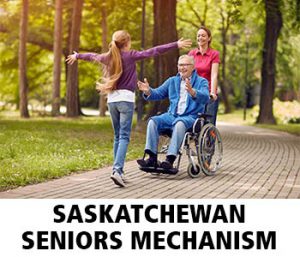 Thumbnail image of older man in wheelchair being pushed by a younger aide while a teen runs toward him, arms outstretched. They are on a brick path in a park. Caption is Saskatchewan Seniors Mechanism.