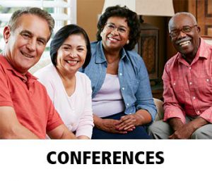 Thumbnail image of four ethnically diverse people, two men and two women, sitting together, all smiling at the camera. Caption is Conferences.