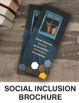 Thumbnail image of Social Inclusion brochure. Shows two brochures on a wooden table. Image of window with butterfly behind it, followed by identifying words. Caption is Social Inclusion Brochure.
