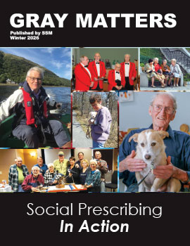 Gray Matters cover thumbnail image, Winter 2026, "Social Prescribing in Action". Montage of 6 different photos. 1. Man in motorboat on lake, with hill behind him; 2. 4 men in red jackets (quartet); 3. people sitting on bench near stairs; 4. Smiling man with small dog on his lap; 5. Smiling men and women gathered around table with wood carving tools; 6. Woman on woodland path holding small dog